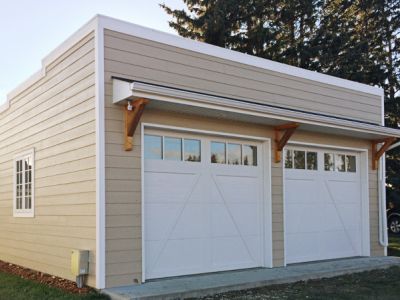 <div class='capText'>Garage we designed to look like it has always been on the farm. </div>